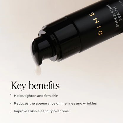 Black serum bottle with gold text and a dropper dispensing clear liquid.